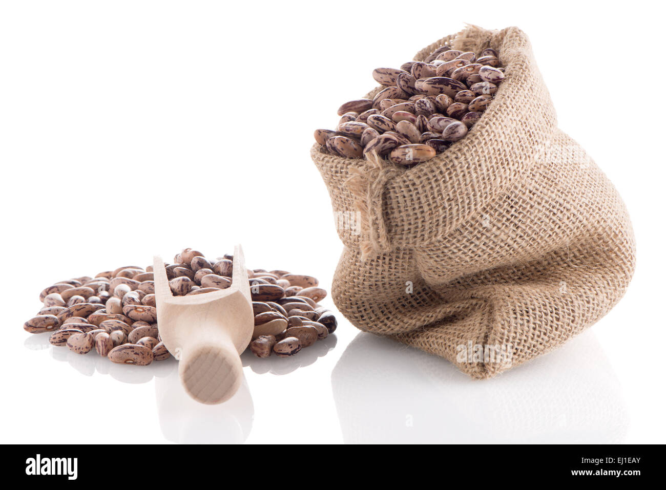 Pinto beans bag with wooden scoop on white background Stock Photo Alamy