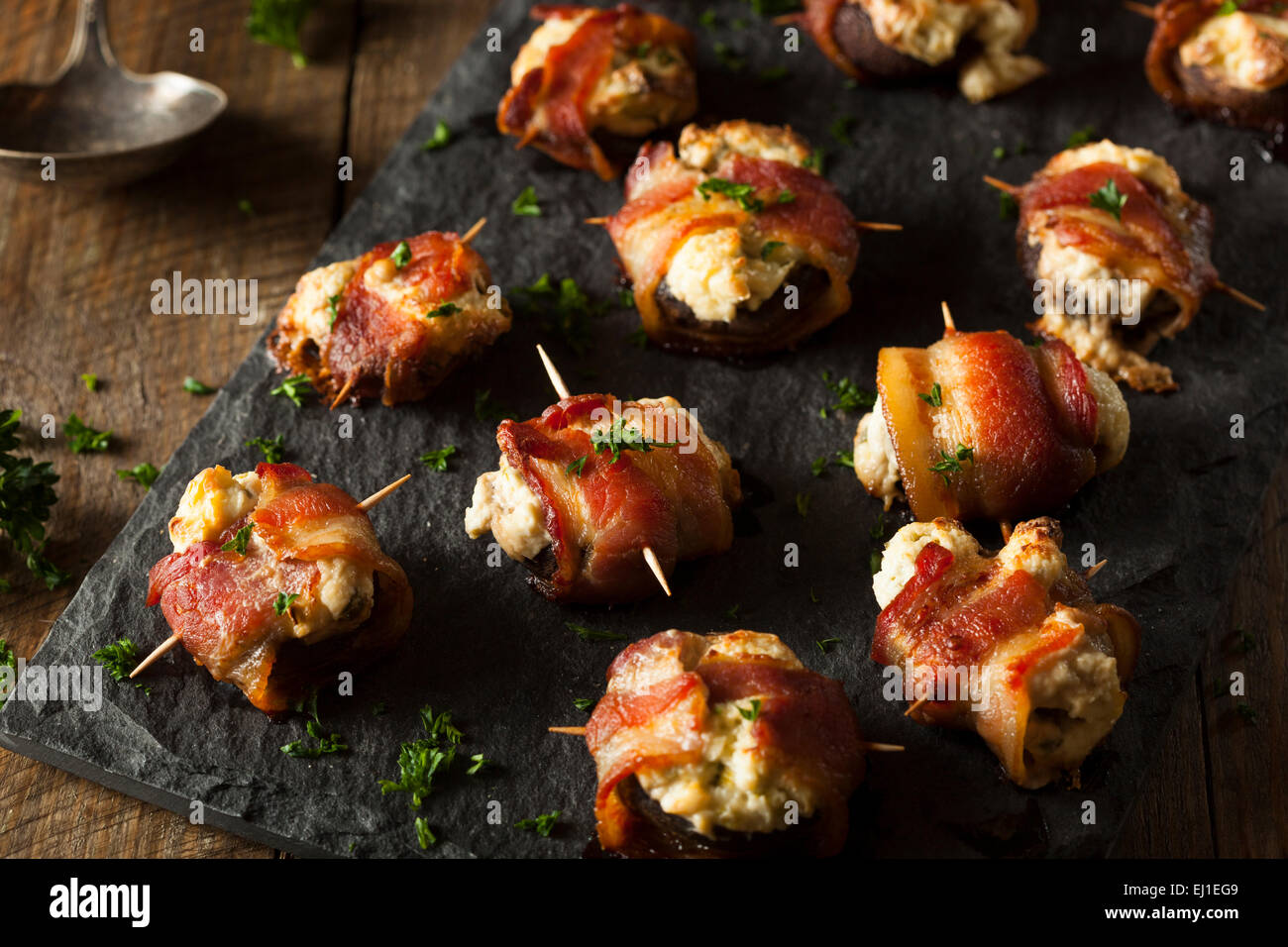 Homemade Bacon Wrapped Mushrooms Stuffed with Cream Cheese Stock Photo