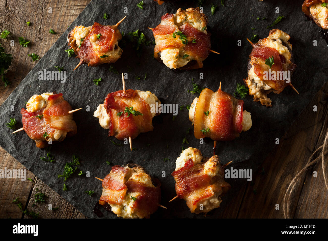 Homemade Bacon Wrapped Mushrooms Stuffed with Cream Cheese Stock Photo