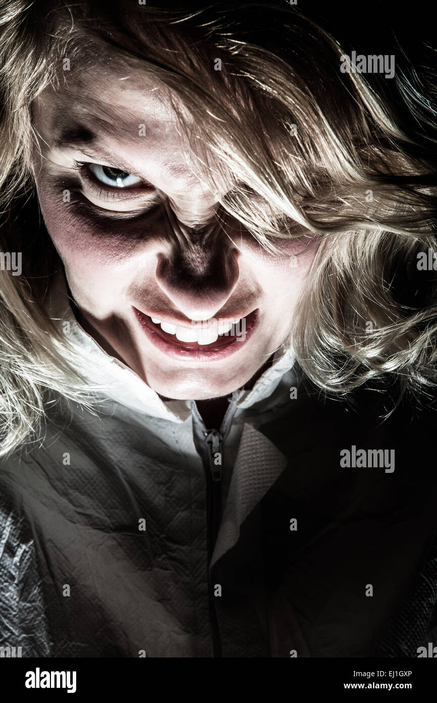 Scary Psycho Blonde Woman Frustrated and Looking at the Camera Stock Photo