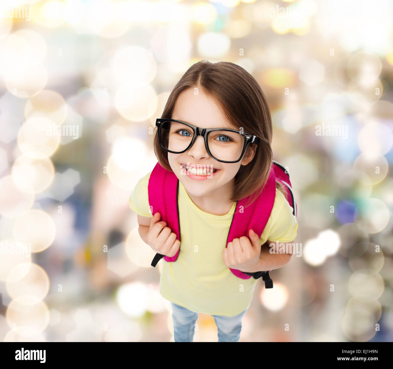 happy smiling teenage girl in eyeglasses with bag Stock Photo