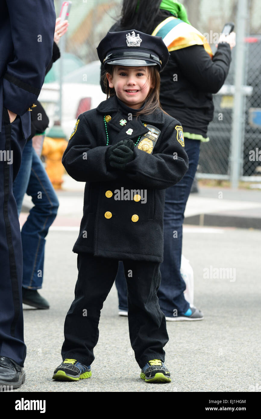 Young girl dressed in a police officer uniform celebrating the 2013 St. Patricks Day Parade. Newark, New Jersey. USA. Stock Photo