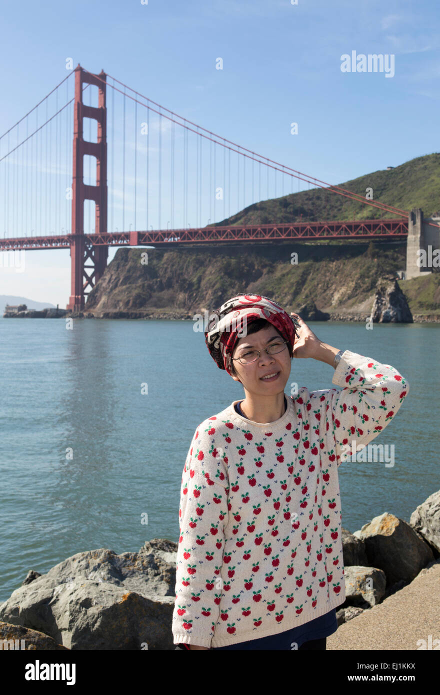 Vietnamese woman female tourist along Satterlee Breakwater at Fort Baker in the city of Sausalito Marin County California Stock Photo
