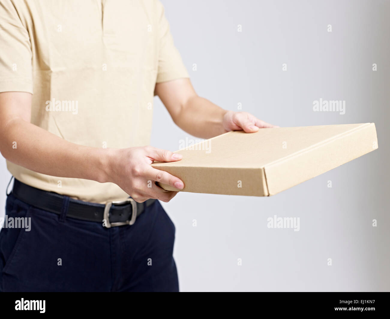 delivery man delivering a package Stock Photo