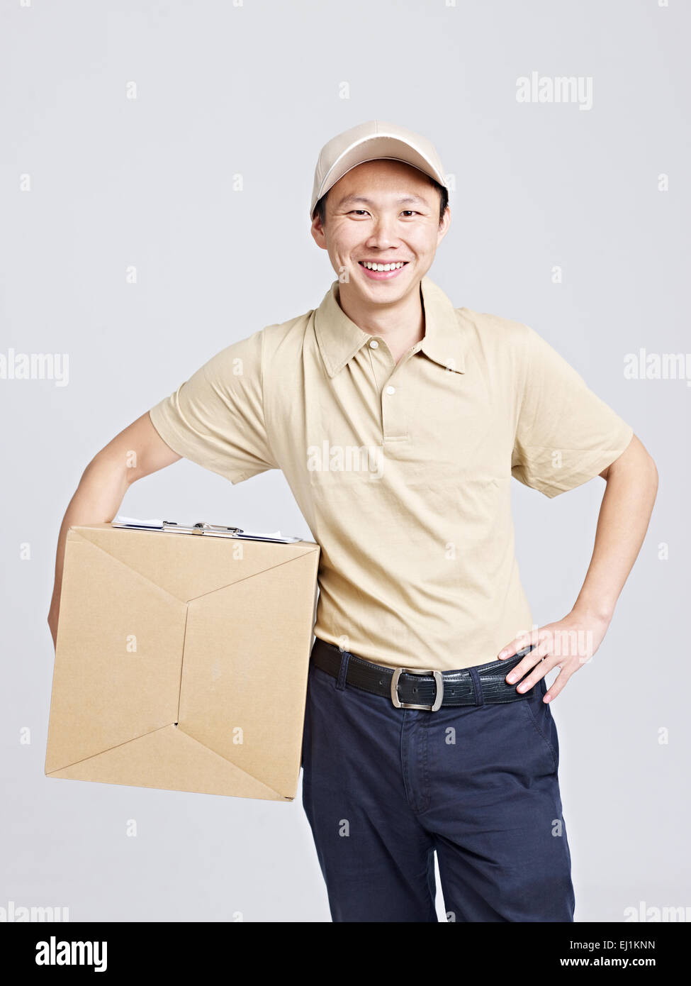 portrait of an asian delivery man smiling. Stock Photo