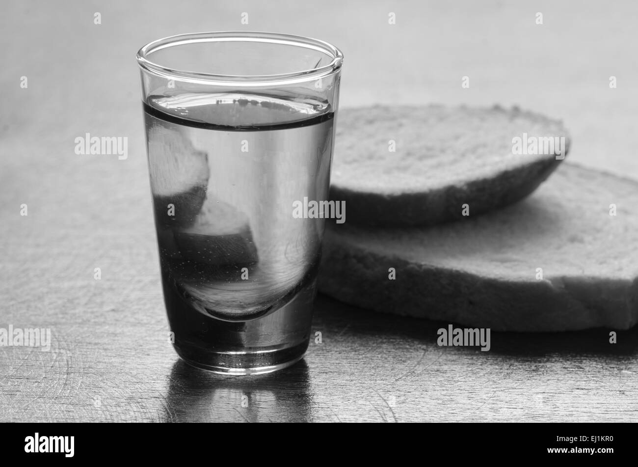 glass of vodka on wooden table Stock Photo