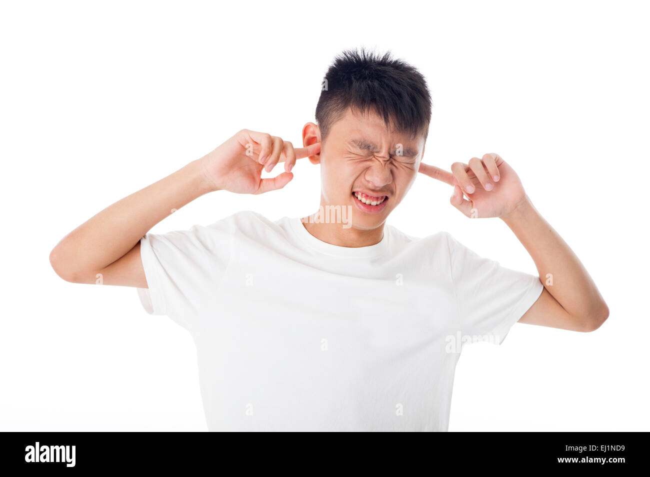 Teenage boy gesturing with facial expression Stock Photo