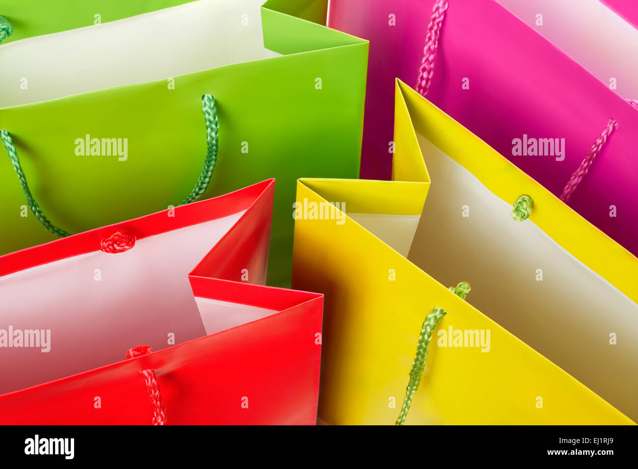 Colorful paper shopping bags background Stock Photo