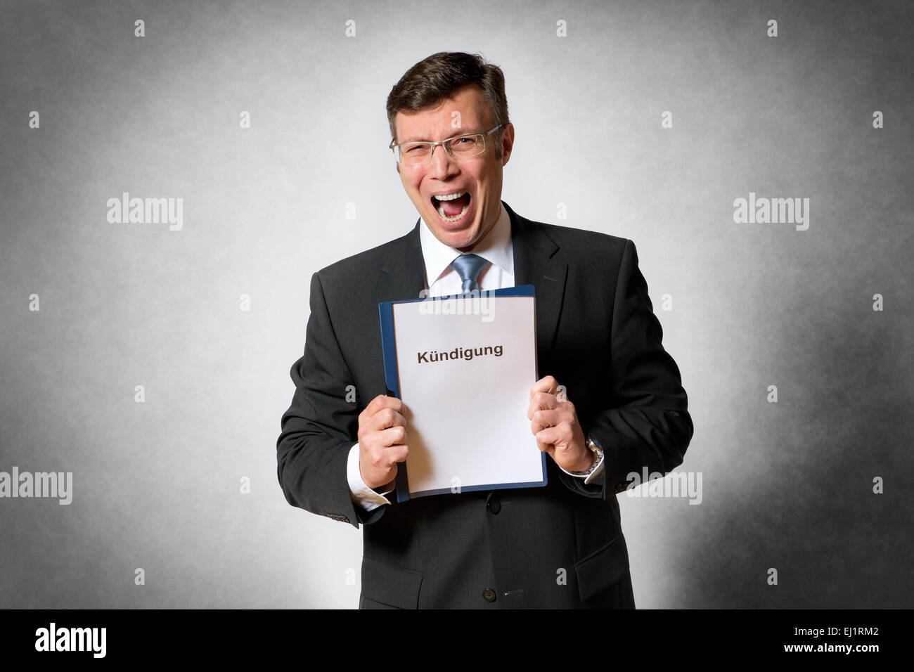 Crying business man with german dismissal Stock Photo