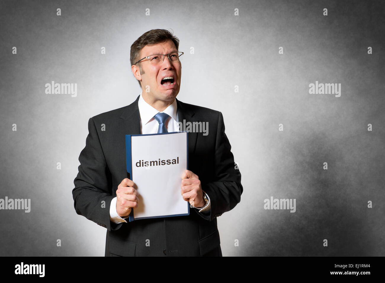 Crying business man with german dismissal Stock Photo