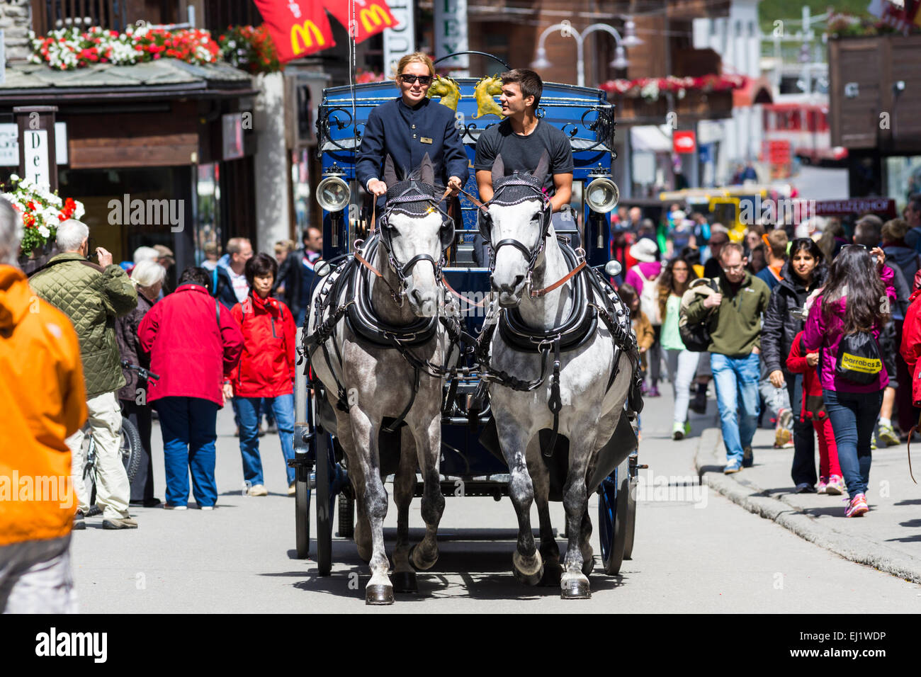 Horsedrawn carriage in Zermatter Bahnhofstraße street, Zermatt, Canton of Valais, Switzerland