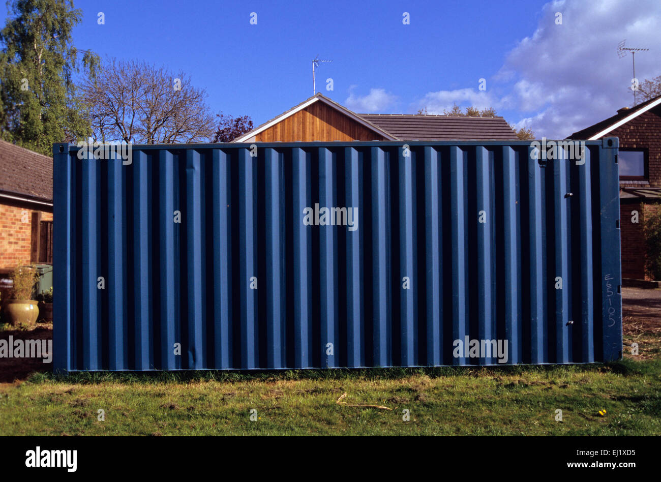 shipping container used as garden shed on front lawn of property in Henley-on-Thames affleunt housing estate Stock Photo