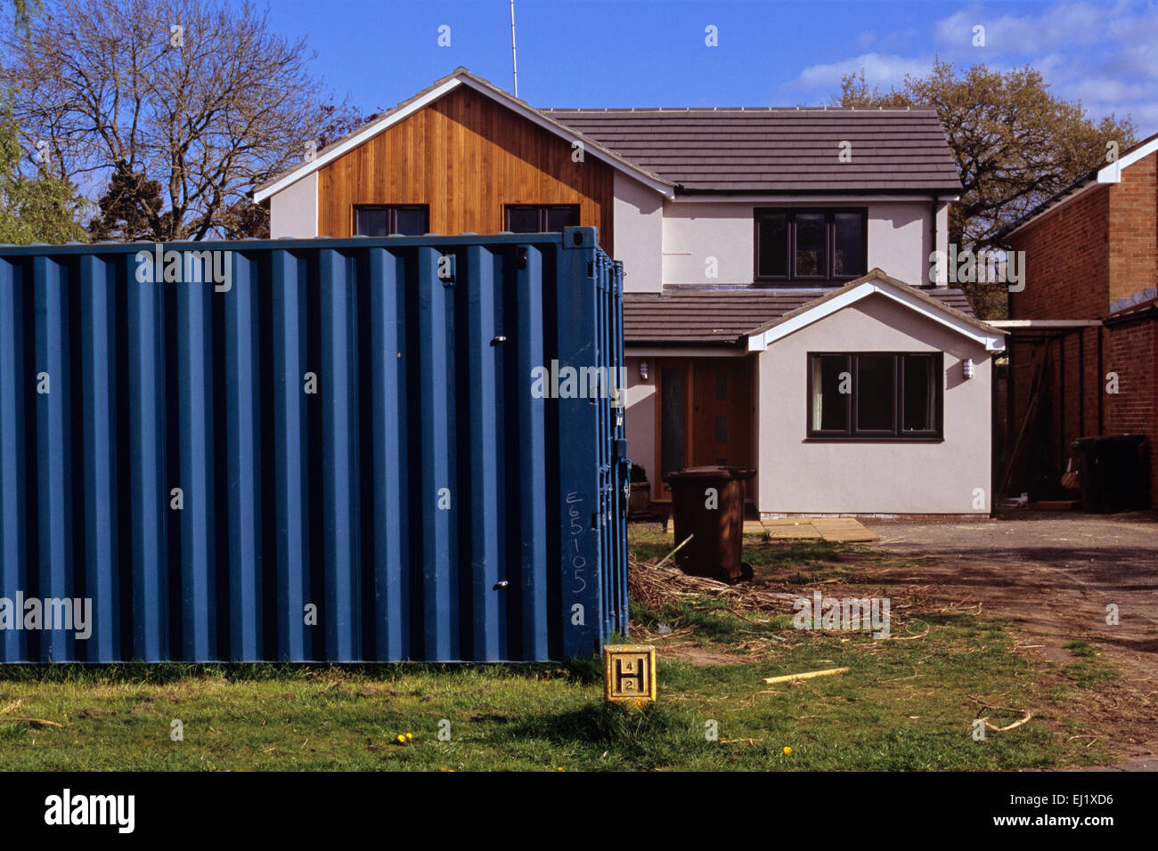 shipping container used as garden shed on front lawn of property in Henley-on-Thames affleunt housing estate Stock Photo