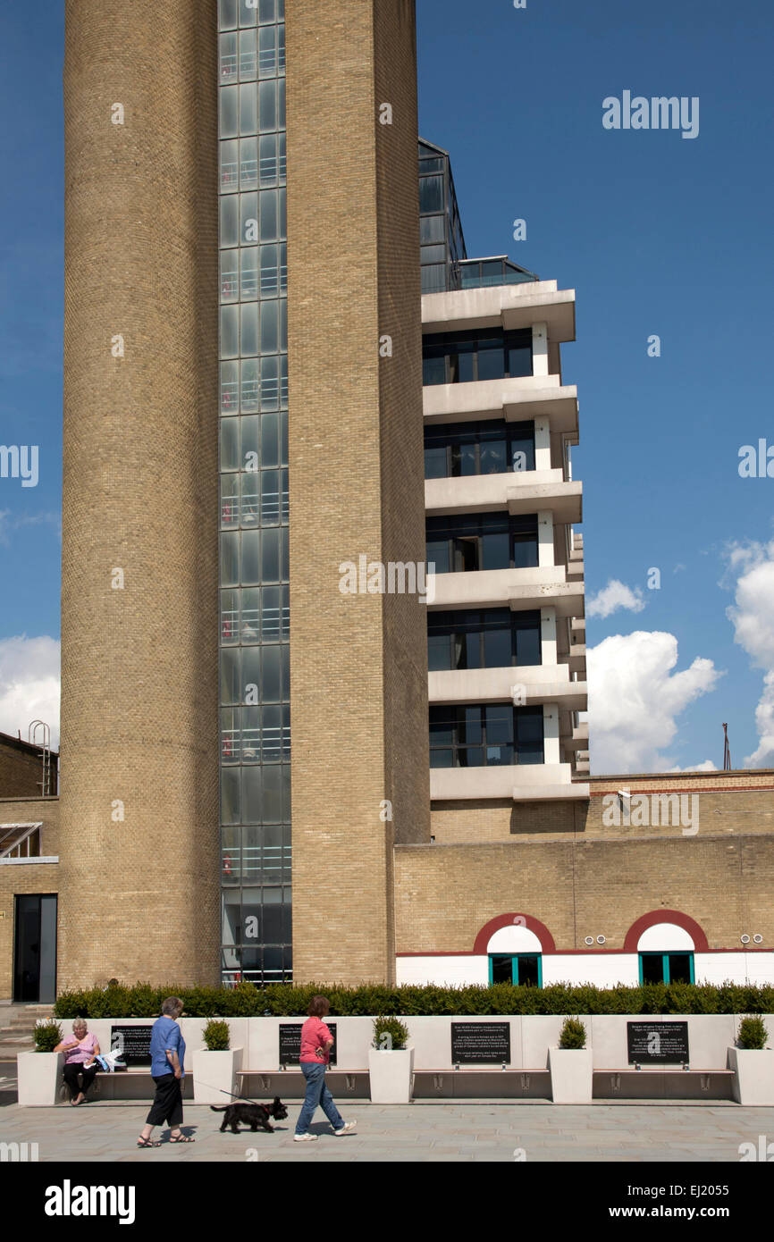 Block of flats on the seafront in Folkestone, Kent, England showing balconies against a blue sky with clouds. Stock Photo
