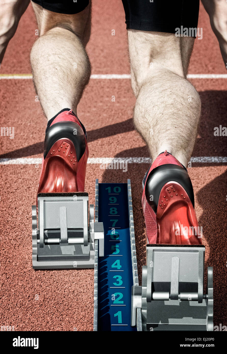 Top view of a male short track runner in the blocks. Desaturated hard