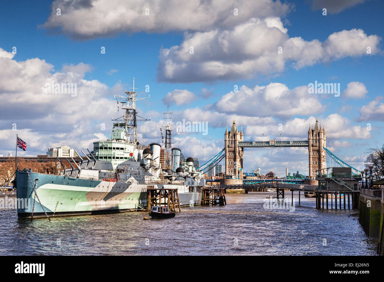 HMS Belfast on the River Thames, and Tower Bridge, London. Stock Photo