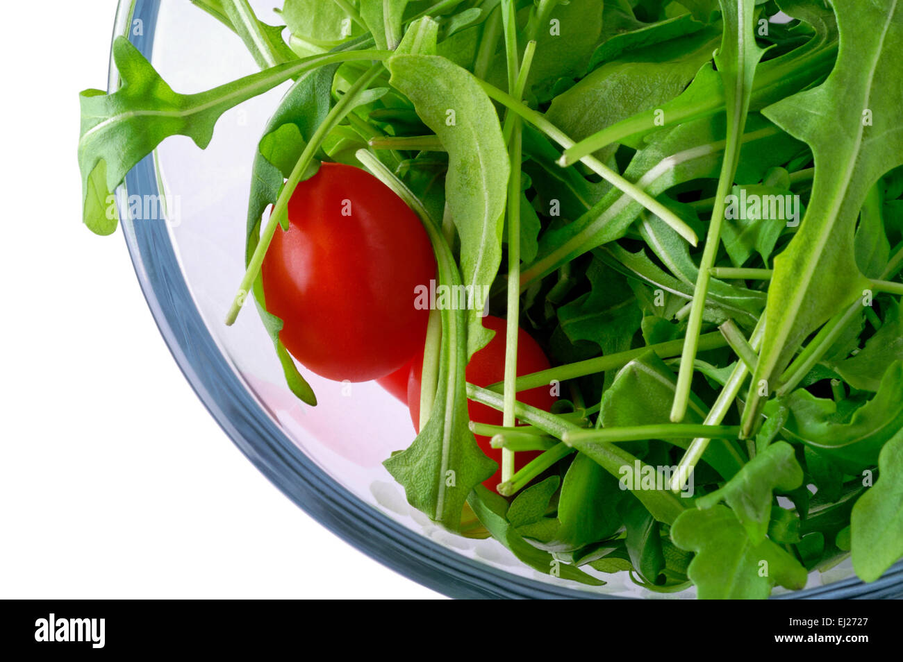 salad with arugula and cherry tomato in glass bowl  with clipping path Stock Photo