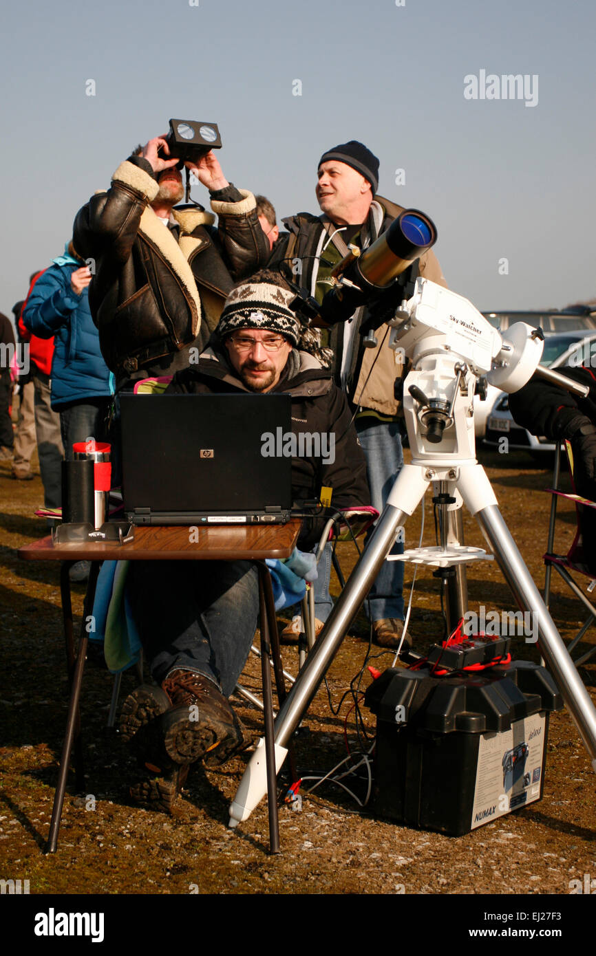 Madley, Herefordshire UK. 20th March, 2015.  Amateur astronomers from the Herefordshire Astronomical Society watching the eclipse through their telescopes, laptops and cameras under clear blue skies in rural Herefordshire. Stock Photo