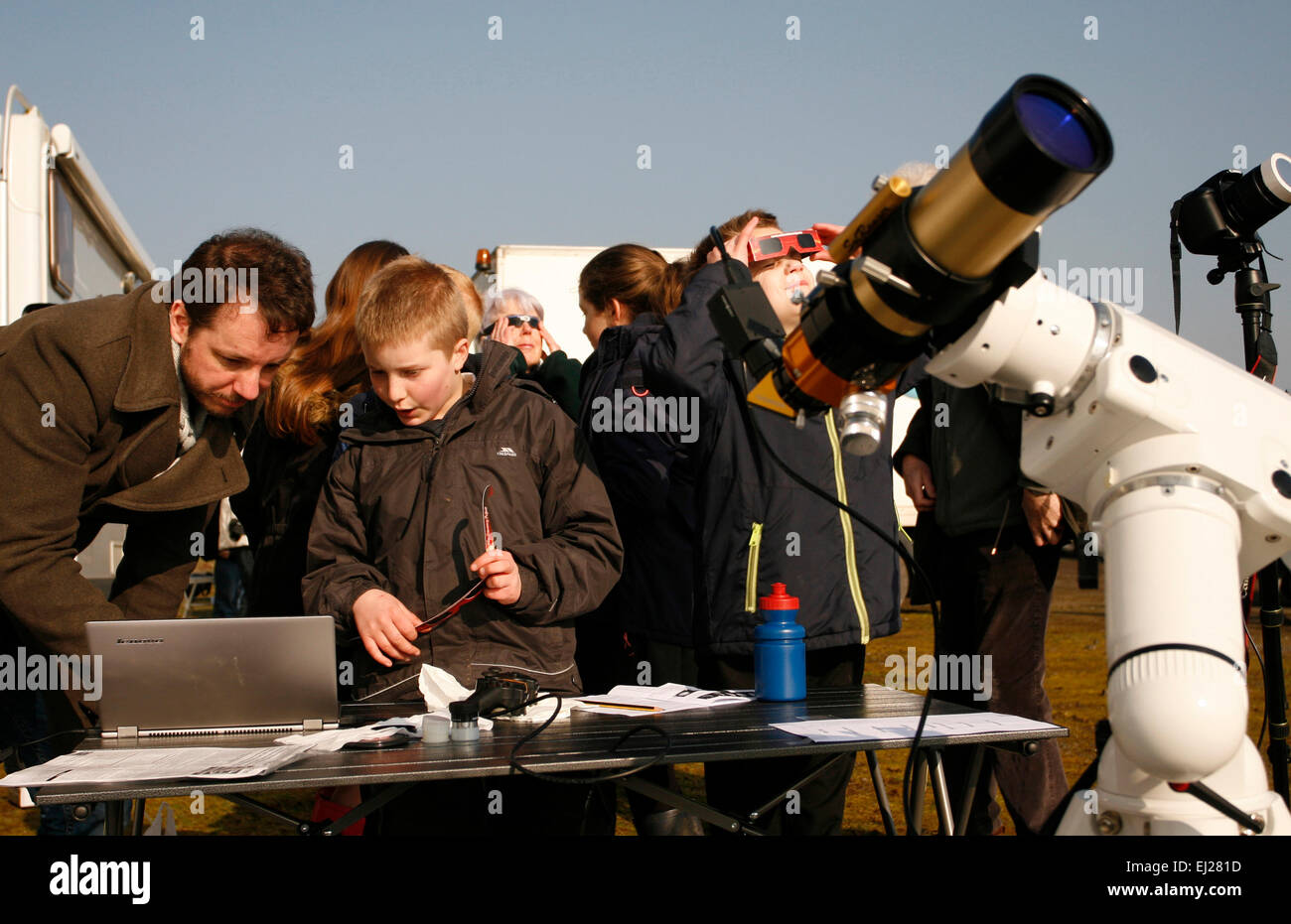 Madley, Herefordshire UK. 20th March, 2015. Amateur astronomers show local school pupils the solar eclipse via a laptop computer linked to a telescope under clear blue skies in rural Herefordshire. Stock Photo