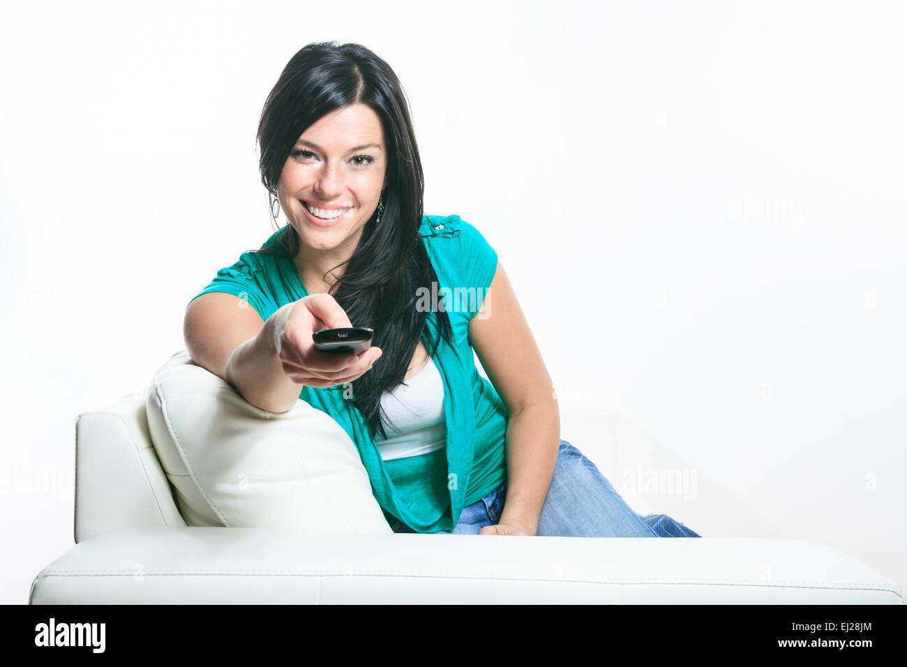 A Beautiful smiling woman relaxing in sofa Stock Photo - Alamy