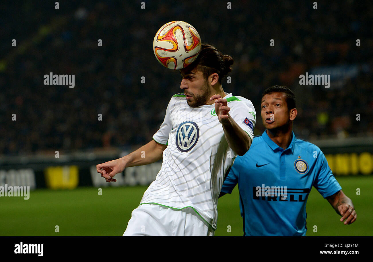 Milan, Italy. 19th Mar, 2015. Wolfsburg's Ricardo Rodriguez (L) and Inter's Fredy Guarín vie for the ball during the UEFA Europa League round of 16 second leg soccer match between Inter Milan and VfL Wolfsburg at Giuseppe Meazza stadium in Milan, Italy, 19 March 2015. Photo: Peter Steffen/dpa/Alamy Live News Stock Photo