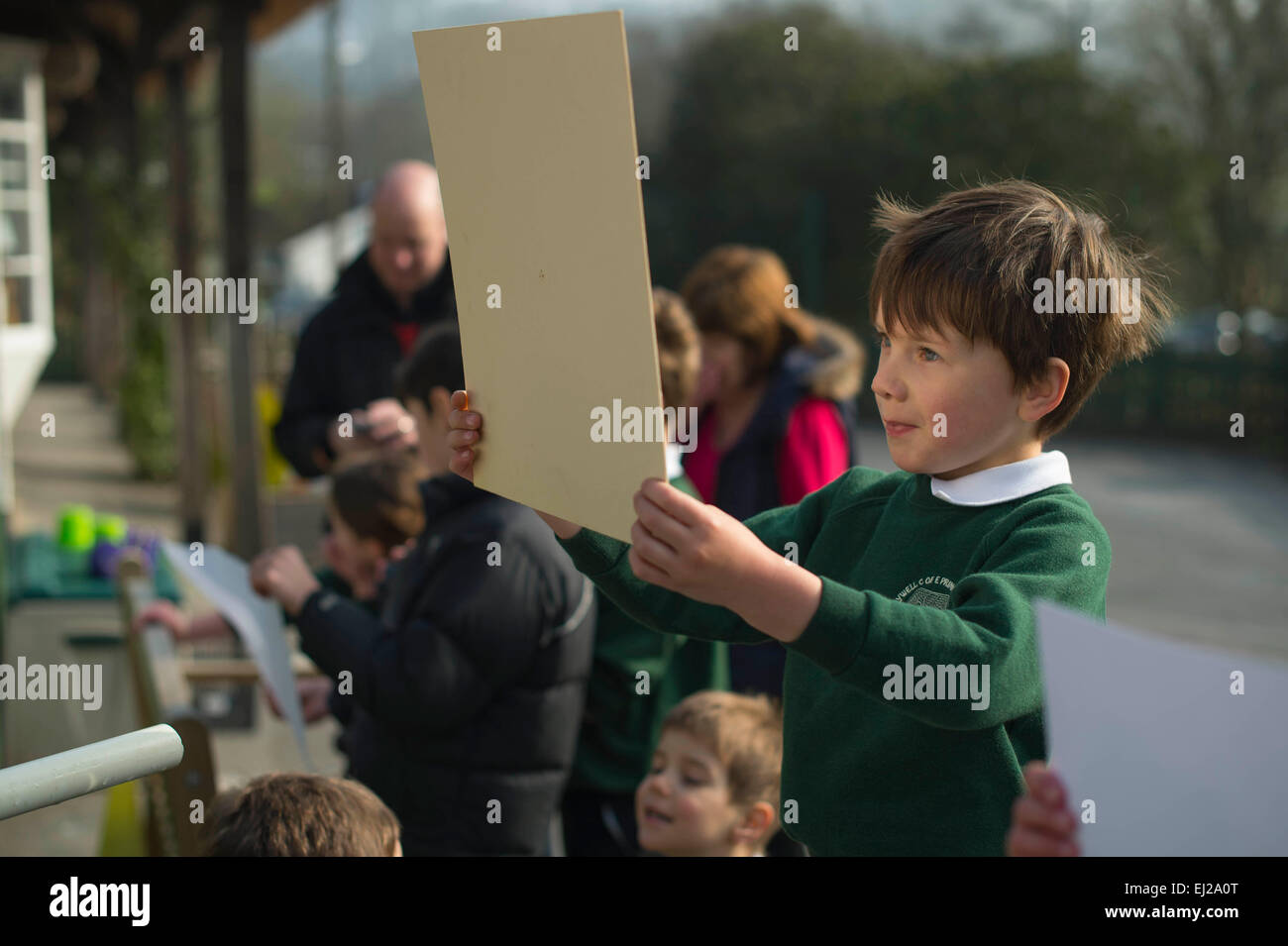 Tawstock, North Devon, UK. 20th Mar, 2015. Pupils from Holywell Primary School, in Tawstock, North Devon, watching the solar eclipse. Credit:  Jim Wileman/Alamy Live News Stock Photo