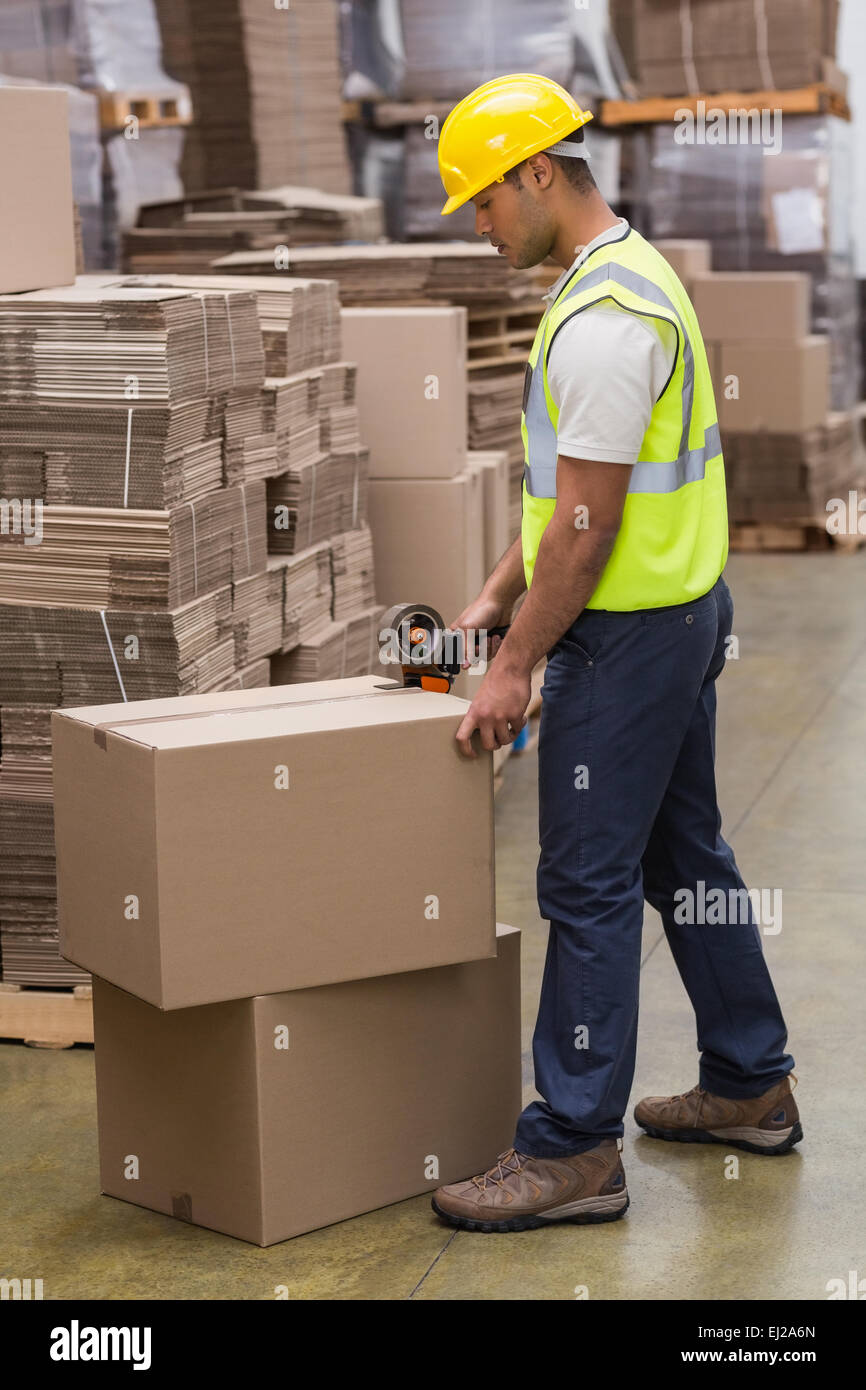 Worker preparing goods for dispatch Stock Photo