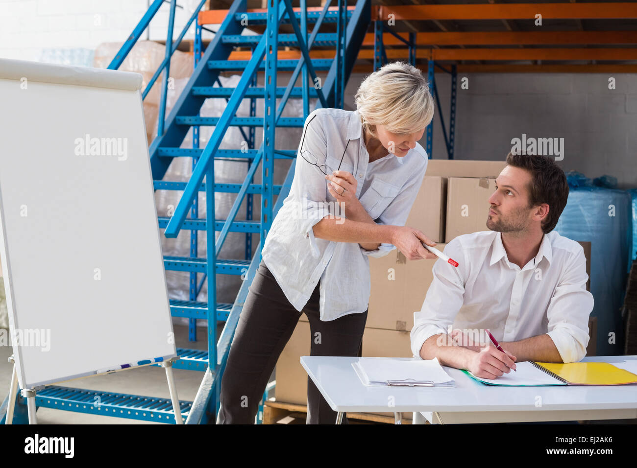 Focused warehouse managers during a presentation Stock Photo - Alamy