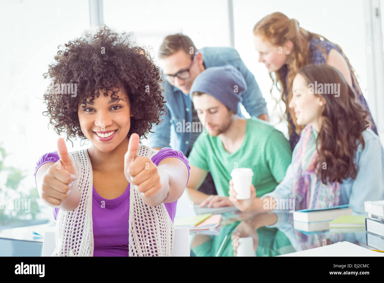 Fashion students with thumbs up Stock Photo - Alamy