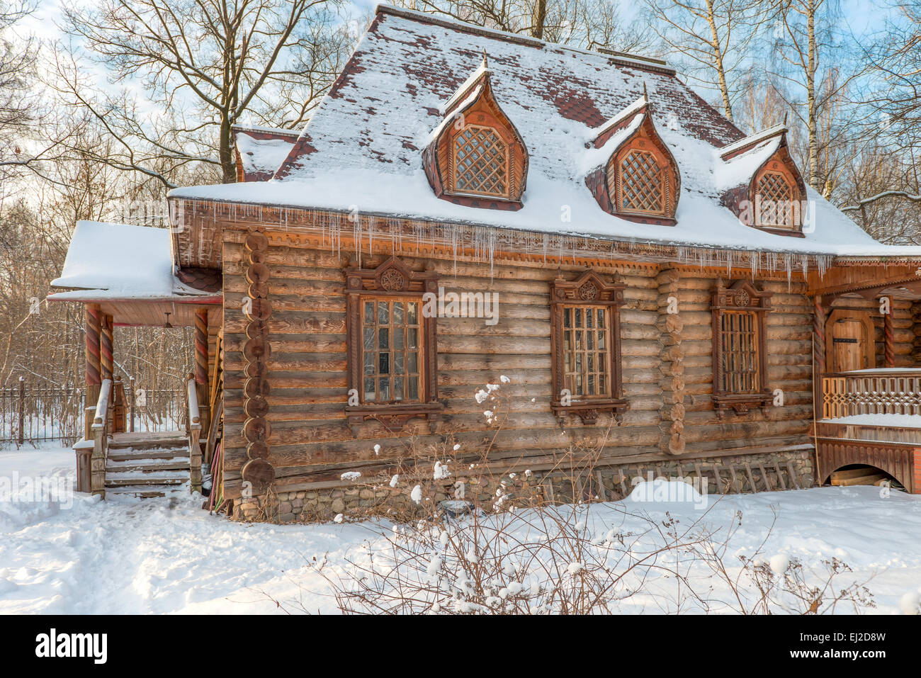 Wooden house in the old style in a snowy forest Stock Photo - Alamy