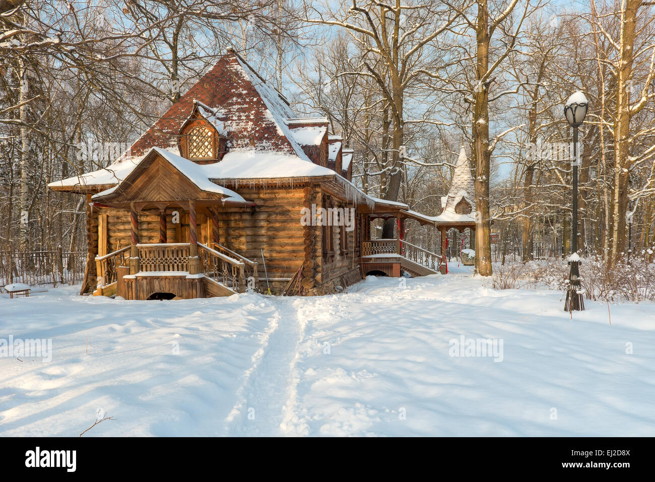 Wooden house in the old style in a snowy forest Stock Photo - Alamy