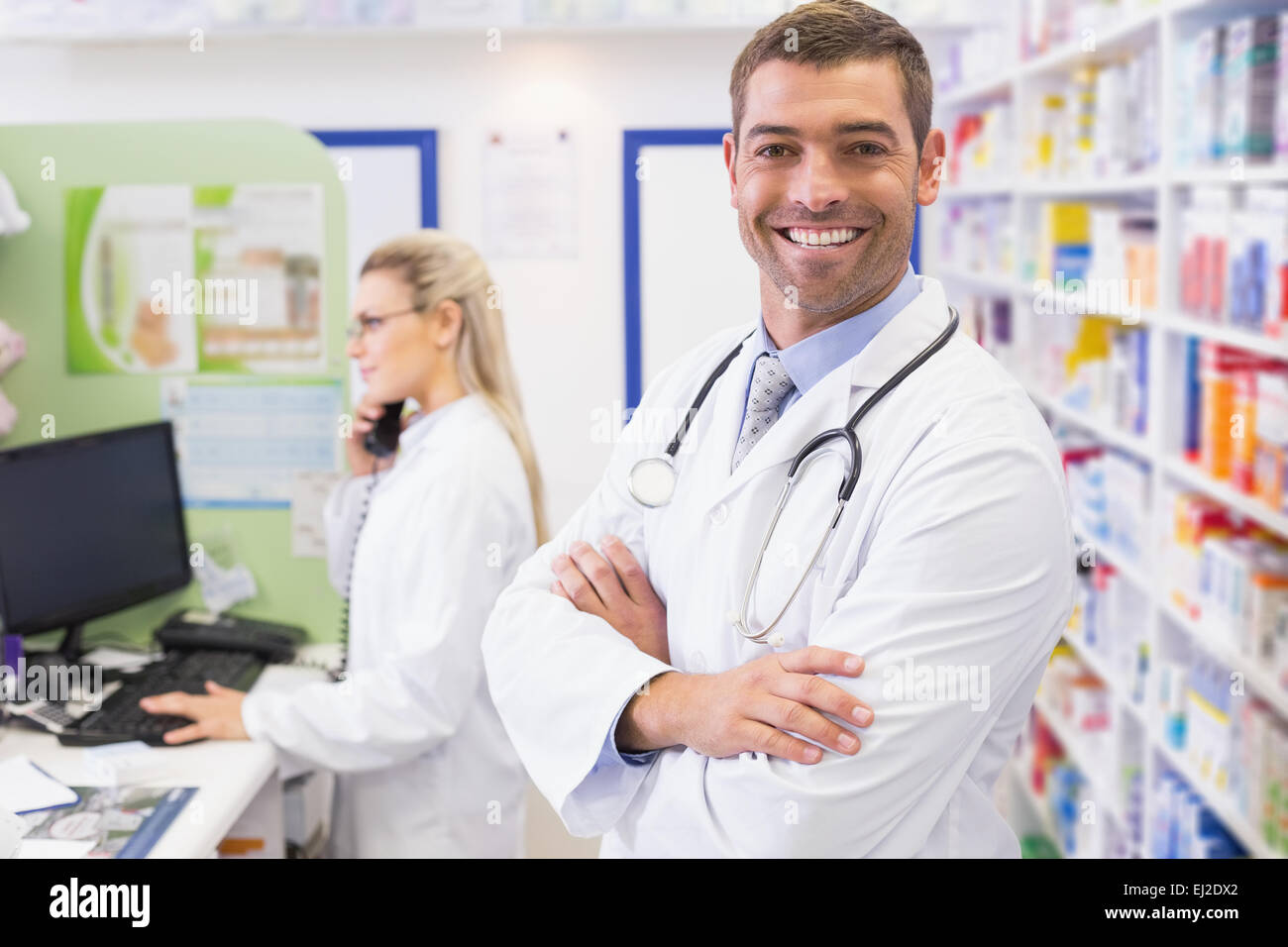 Pharmacist smiling with Pharmacist on the phone Stock Photo