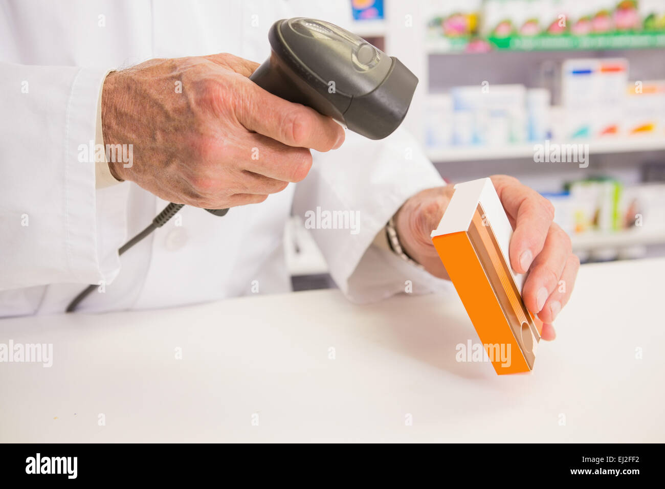 Pharmacist scanning medication scanner hi-res stock photography and ...