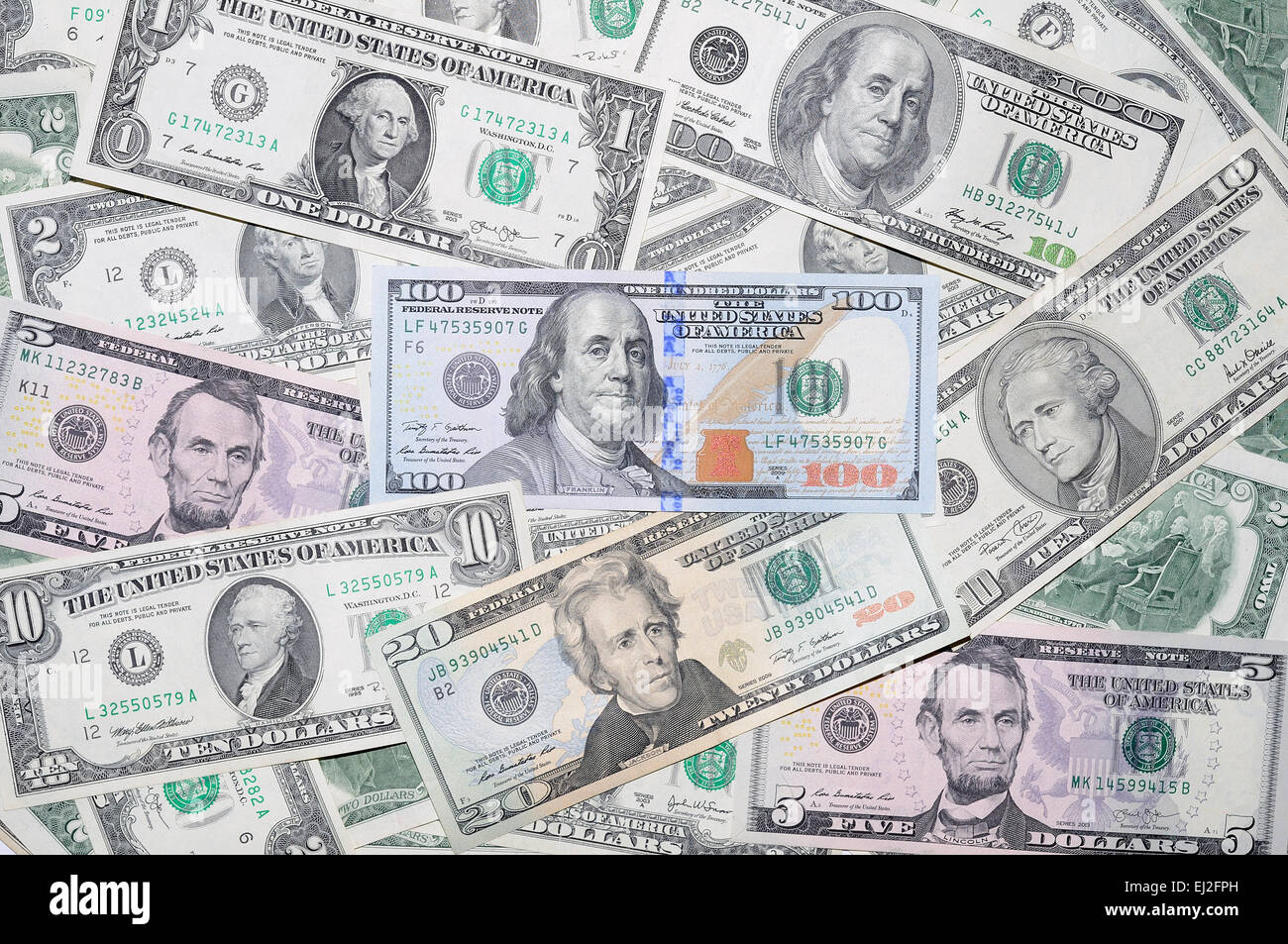 Many  different denominations of banknotes US dollars Stock Photo