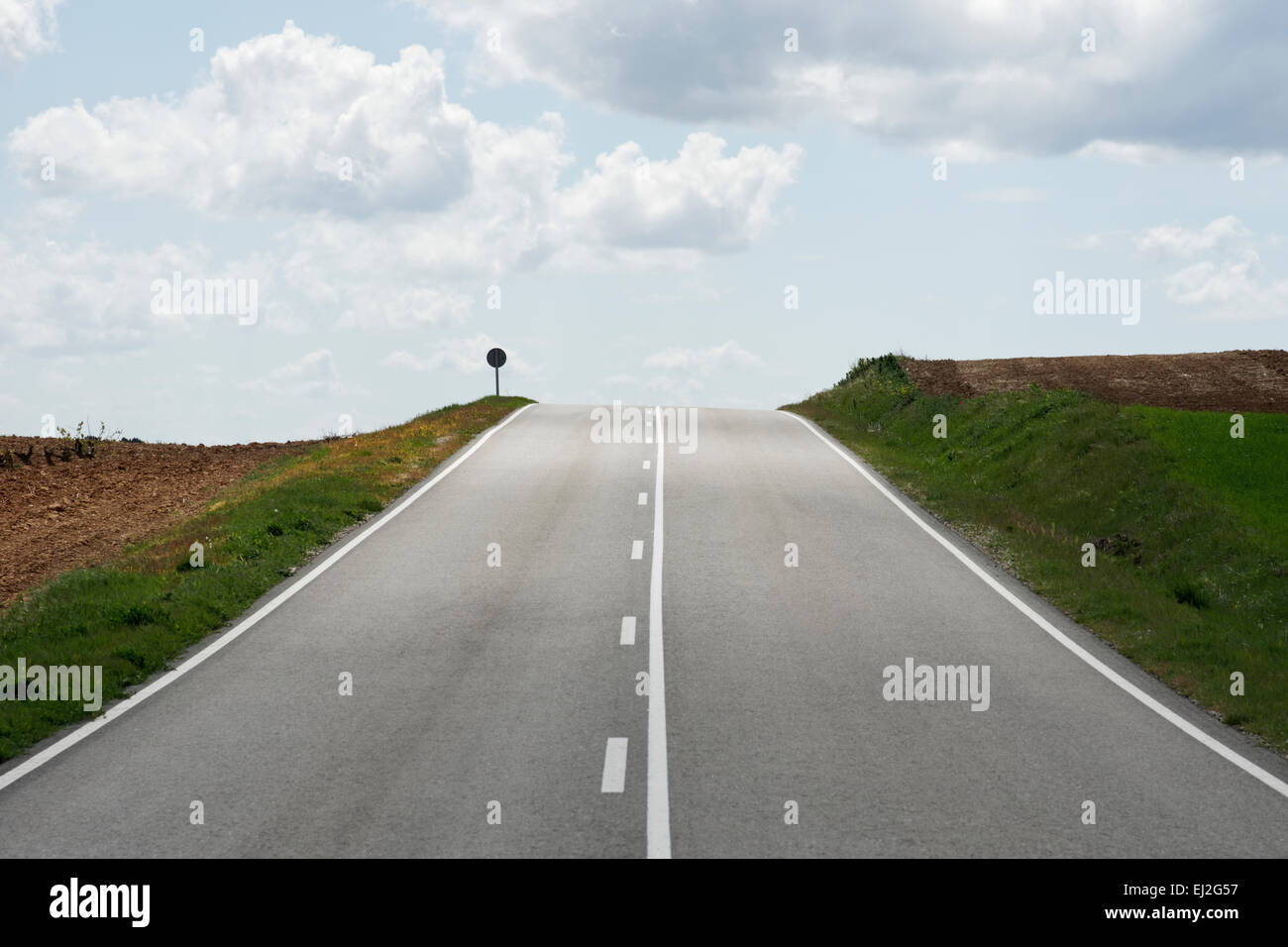 Lonely road in countryside hi-res stock photography and images - Alamy