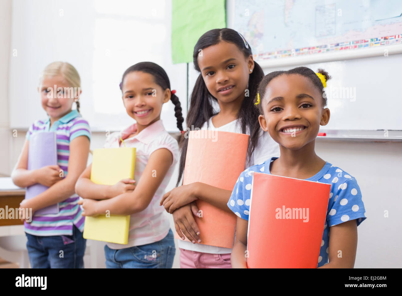 Cute pupils smiling at camera during class presentation Stock Photo - Alamy