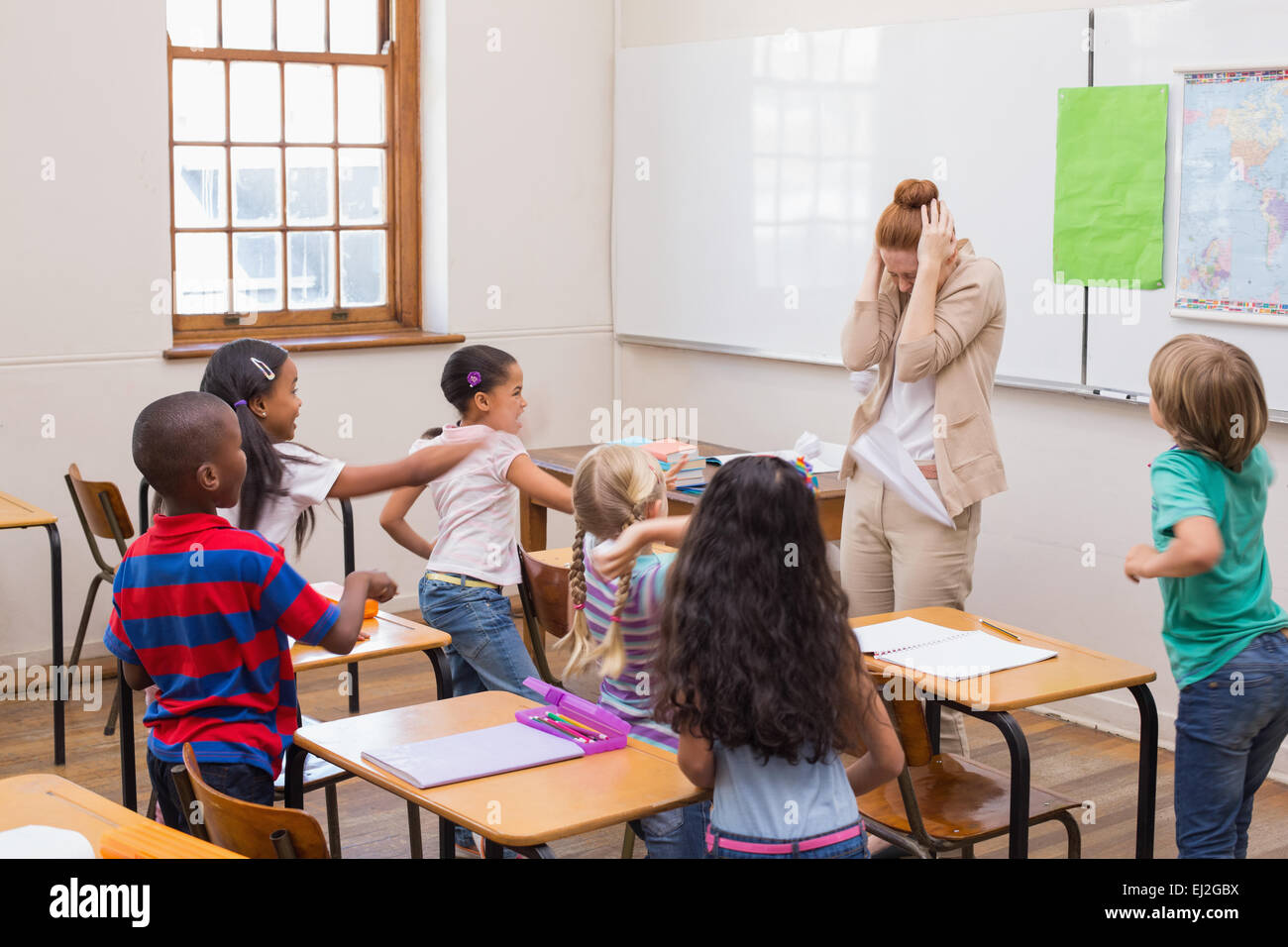 Naughty pupils in class Stock Photo