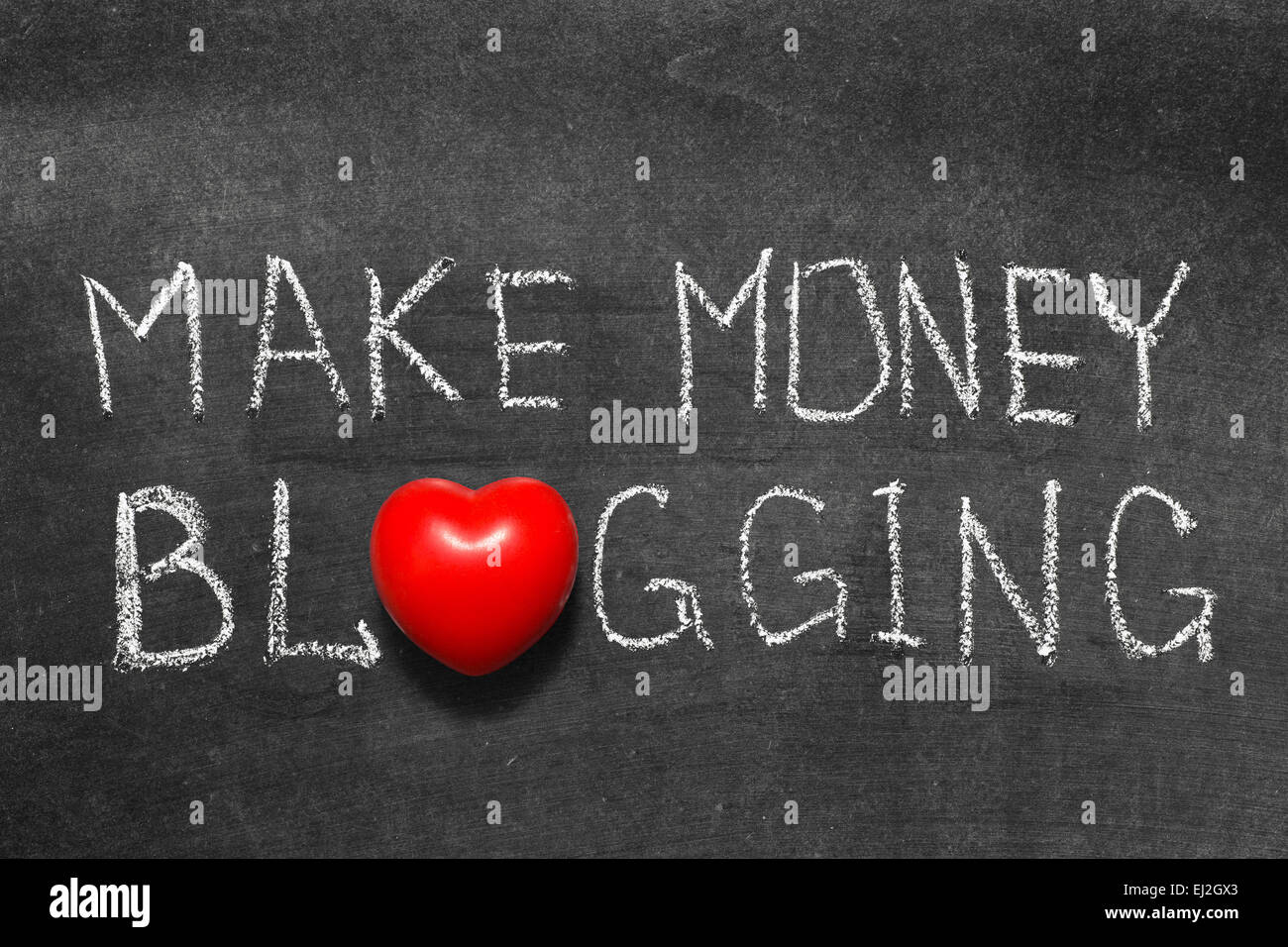 make money blogging phrase handwritten on blackboard with heart symbol instead of O Stock Photo