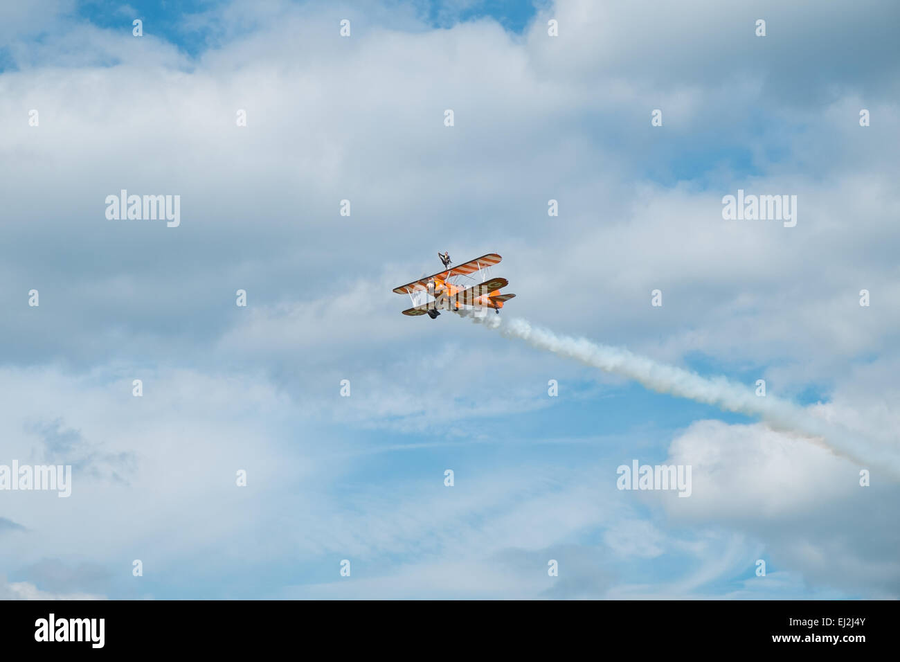 ASCOT, UK - AUGUST 16, 2014: Wing walking display at the Red Bull Air Race in Ascot, August 16, 2014. Stock Photo
