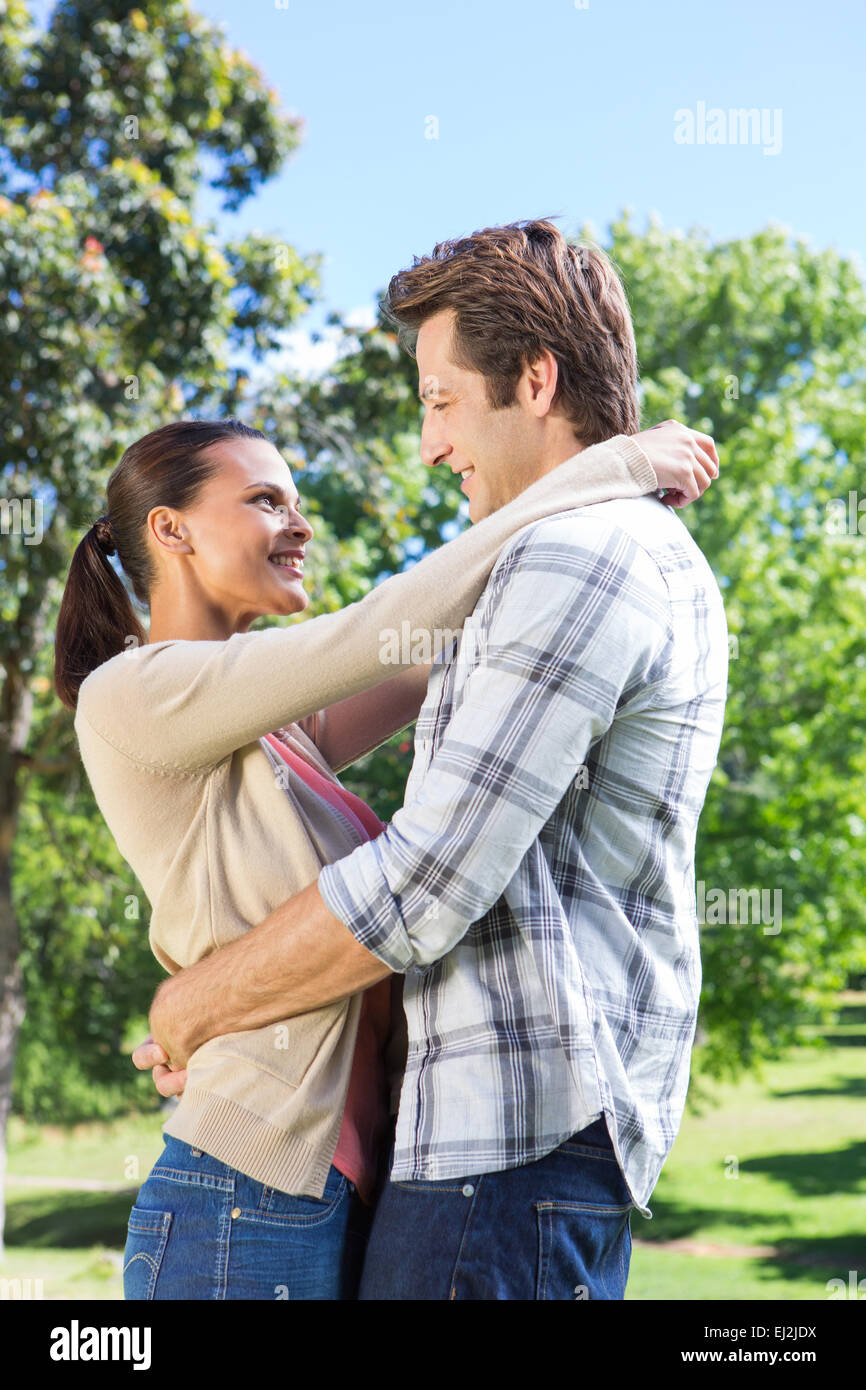 Happy couple hugging in park Stock Photo - Alamy