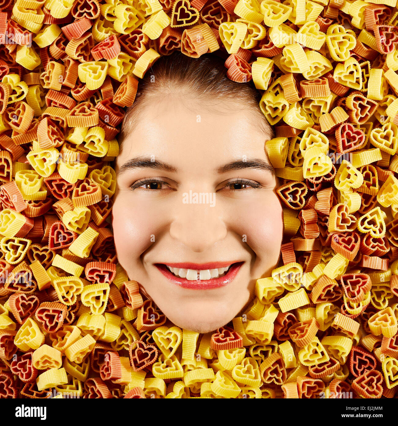 Beautiful woman expression face with tri-color pasta frame Stock Photo