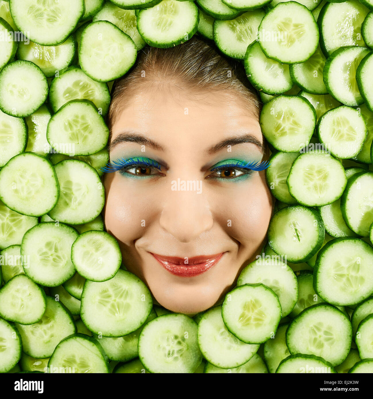 Beautiful woman expression face with cucumber slice frame Stock Photo