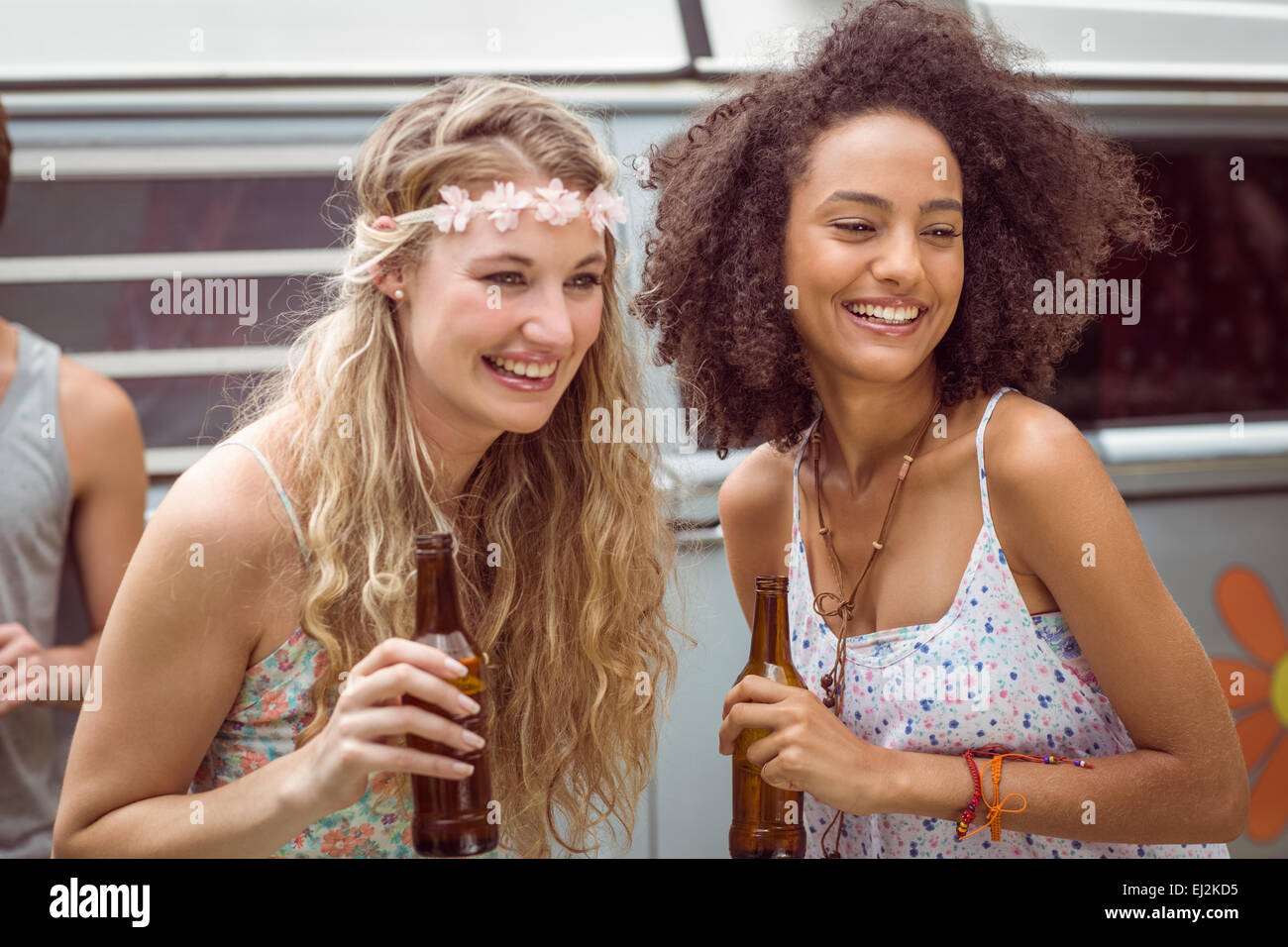 Pretty hipsters toasting with beer Stock Photo