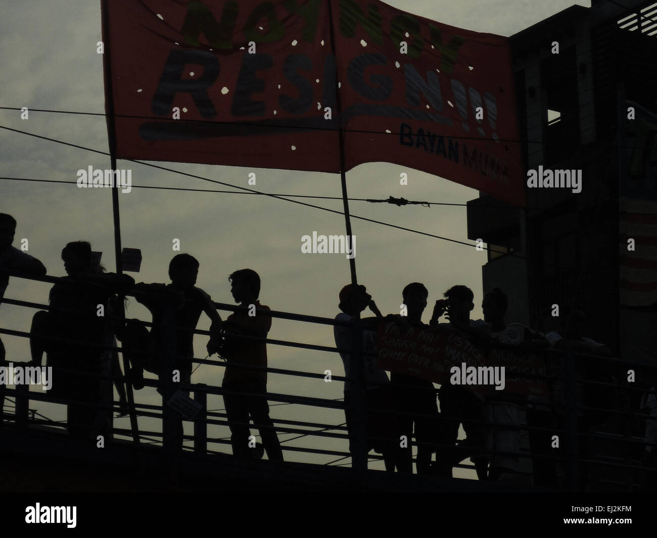 Manila, Philippines. 20th Mar, 2015. Filipino activists take a rest under a banner calling for the resignation of Philippine President Benigno Aquino III, during a rally at Mendiola. President Aquino is facing calls for his removal over the botched anti-terror operation last January 25 in Mamasapano, Maguindanao to hunt wanted Malaysian bombmaker Zulkifri bin Hir, alias Marwan, that resulted in the deaths of 44 police commandos. Credit:  Richard James Mendoza/Pacific Press/Alamy Live News Stock Photo