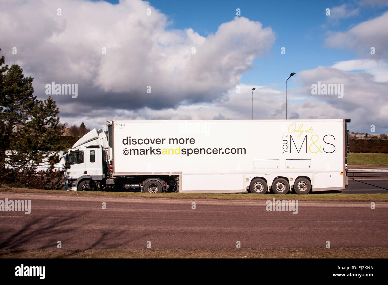 Marks & Spencer articulated lorry travelling along the Kingsway West Dual Carriageway in Dundee, UK Stock Photo