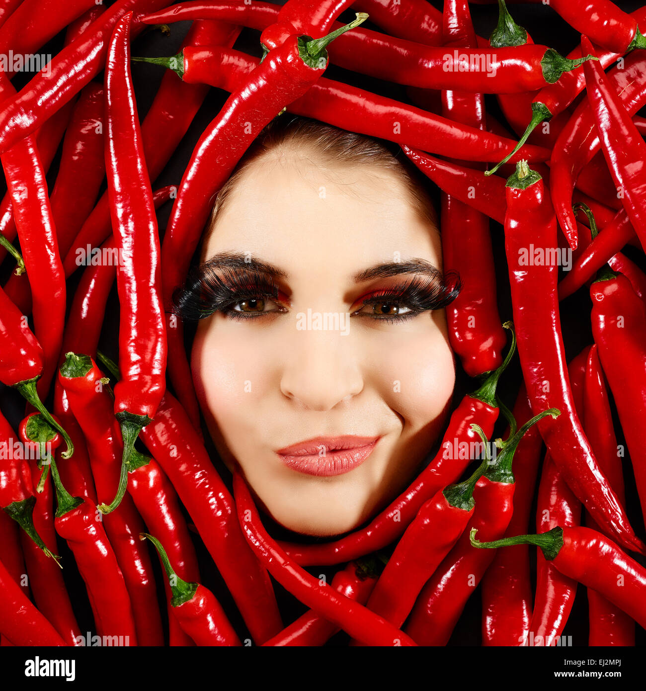 Beautiful woman expression face with red chili pepper frame Stock Photo