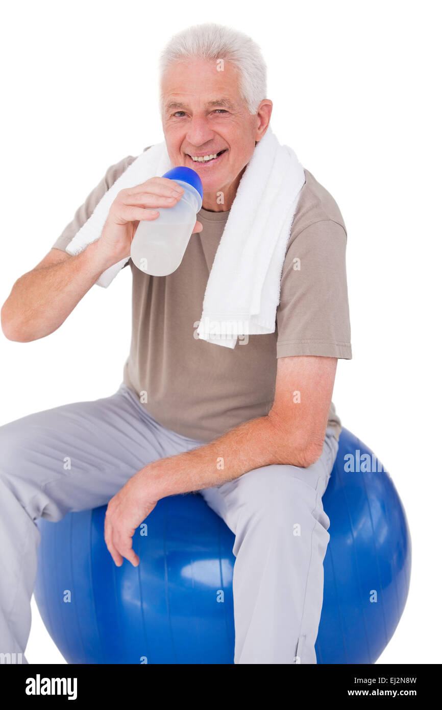 Senior man drinking from water bottle Stock Photo - Alamy