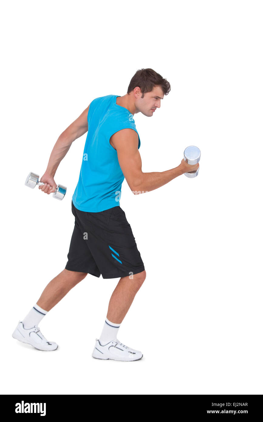 Fit man lifting heavy dumbbells Stock Photo Alamy
