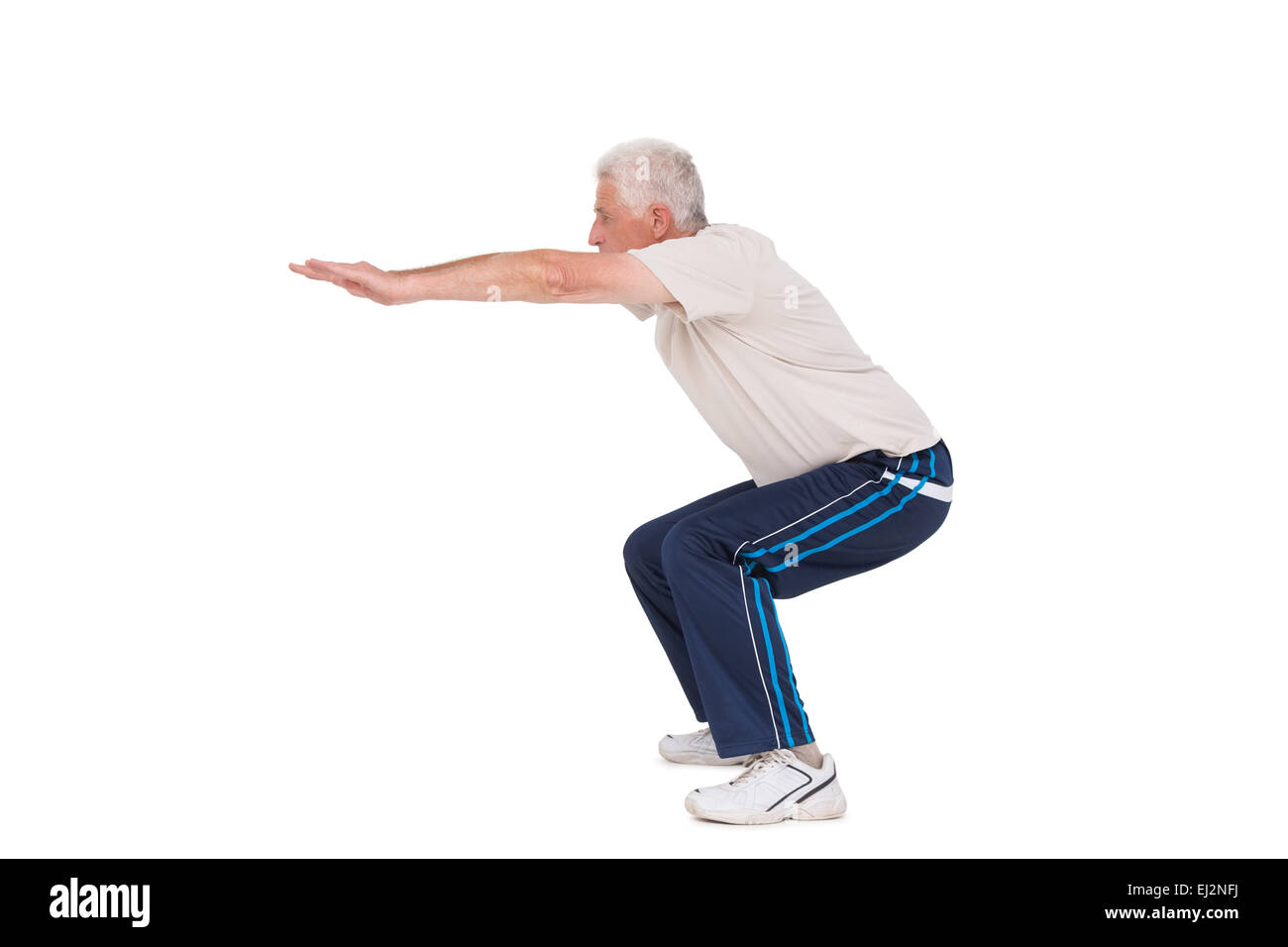 Senior man doing a squat Stock Photo Alamy