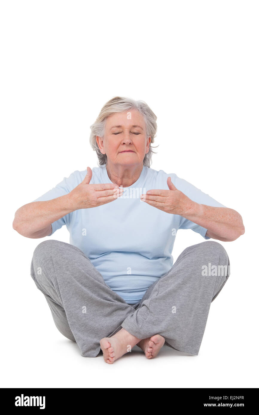 Senior woman doing yoga exercise Stock Photo - Alamy